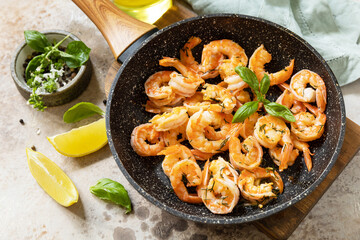 Spicy garlic chili Shrimps boiled shrimps and herbs, prawns in a frying pan with lemon. Seafood, shellfish.