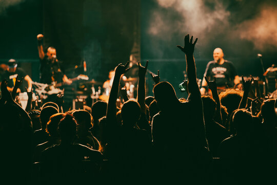 Crowd At Concert And Blurred Stage Lights.