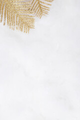 Golden glitter branches on snow background with copy space Christmas and New Year background