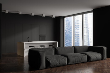 Kitchen interior with countertop, couch and bar chairs near panoramic window