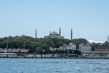 Obraz premium Wide angle Istanbul view with Hagia Sophia Mosque, beautiful landscape with trees, footage of cityscape and mosque, travel with ferry tour in Istanbul