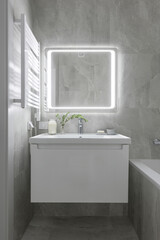 modern bathroom interior, bathroom with gray tiles with stone texture