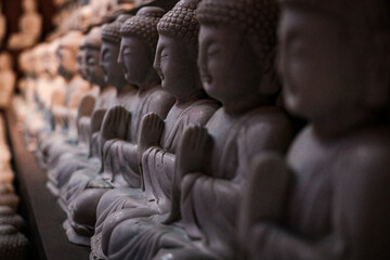 Many buddha scultptures in korean buddhist temple - obrazy, fototapety, plakaty