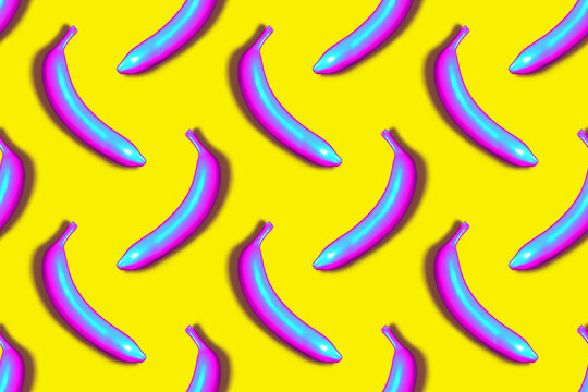 Seamless Pattern Of Blue And Pink Iridescent 3D Rendered Bananas On Yellow Background With Drop Shadow.