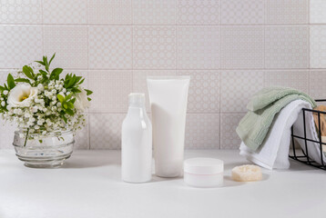 Obraz na płótnie Canvas Natural cosmetics, skin care product on table in bathroom. Blank cosmetic skincare makeup containers.