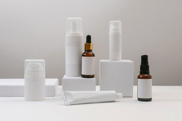 Cosmetic bottle containers with blank label for branding mock-up. Natural cosmetics with herbal...