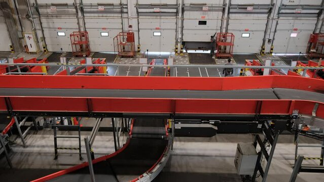 Parcels Are Moving On Belt Conveyor At Post Sorting Office.