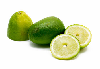 fresh whole and slices green Lemons isolated on white background.