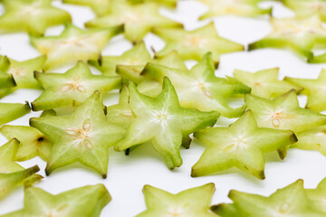 Ripe carambolas or Star fruit slices on white background