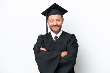 Middle age university graduate man isolated on white background keeping the arms crossed in frontal position