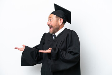 Middle age university graduate man isolated on white background with surprise facial expression