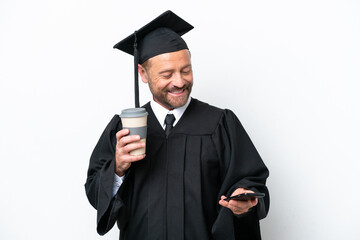 Middle age university graduate man isolated on white background holding coffee to take away and a mobile