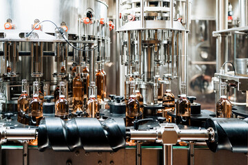 Industrial wine bottling plant theme. Modern industry production line for alcohol drink bottling...