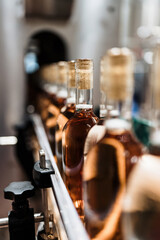 Industrial wine bottling plant theme. Modern industry production line for alcohol drink bottling and packaging.