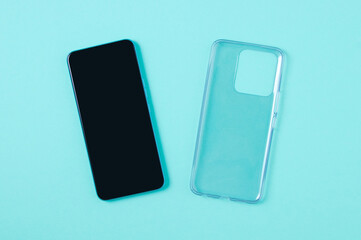 Protective transparent silicone case smartphone. Turquoise background.