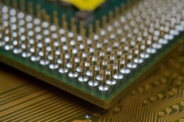 microprocessor on the background of the microcircuit of the motherboard