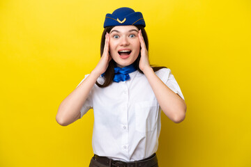 Airplane stewardess Russian woman isolated on yellow background with surprise expression