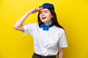 Airplane stewardess Russian woman isolated on yellow background looking far away with hand to look something