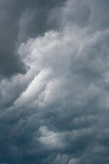 Fototapeta premium dramatic cloudy dark clouds before a storm. deep blue and grey heavy clouds. weather forecast