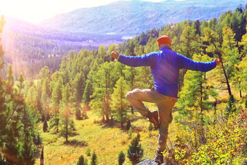 Naklejka premium buddhism meditation travel, man doing yoga in traditional yellow pants in nature