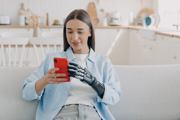 Happy disabled european woman is chatting on smartphone. Equality and life quality concept.