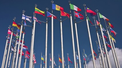 European flags on flagpoles waving with the wind. 4k video footage - Powered by Adobe