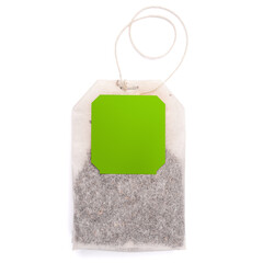 Teabag with green label. Isolated on a white. Tea.