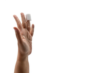 Hand of Asian woman with white medicine bandage on injury finger on white background and copy space and clipping path.