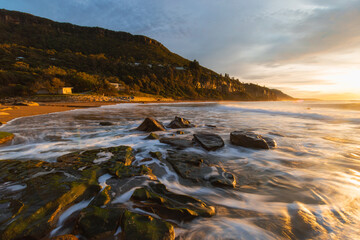 Morning sunlight hitting the Coalcliff Beach coastline, Sydney, Australia.