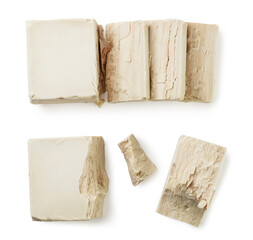 Yeast cut and broken into pieces close-up on a white. Top view