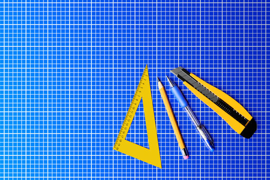3D illustration yellow  cutter,  pencil, pen and ruller on blue background. 3D render and illustration of repair and installation tool