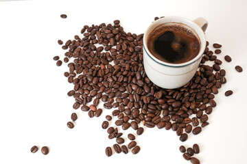 hot espresso and coffee beans arabica or robusta on white table with white background. top view	