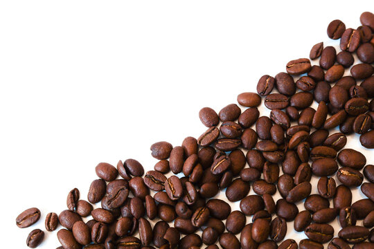 arabica or robusta Coffee beans isolated on white background with space for text. Coffee background or texture concept. free copyspace on the top left
