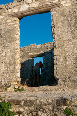 Ksamil, Albania A male  tourist visits the Ali Pasha Ottoman castle at the inlet of Lake Butrint.