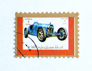 Ajman - circa 1973 : Cancelled postage stamp printed by Ajman, that shows Antique vehicle, circa...