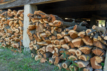 Preparation of firewood for the winter. firewood background, Stacks of firewood