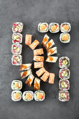 Big sushi set of different rolls. Photo of food on a white background.