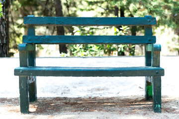 Fototapeta na wymiar Green vintage wooden bench in the park