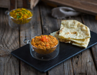 tomato egg with bread served in a dish isolated on cutting board side view of breakfast on wooden background