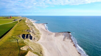 aerial view of Bovbjerg Fyr lighthouse, cliffs and North Sea in summer with blue sky and some...