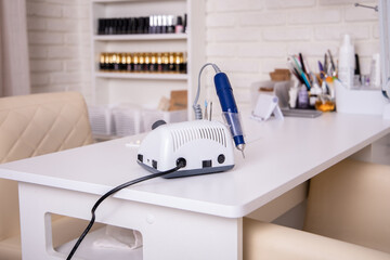 
Working place for nail care master in beauty salon. Modern design and interior.