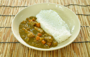 pork with potato and carrot in Japanese curry with rice on plate
