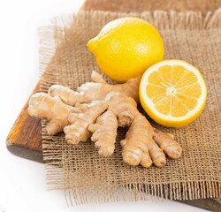 Ginger with lemon on a wooden table