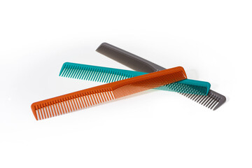 Professional colorful hair combs, hairdresser's tool, for cutting hair, isolated on white