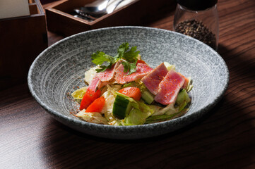 health salad with tuna and vegetables close-up