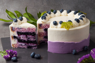 Lavender sponge cake in combination with blueberries, soaked in cheese cream with cream in a duet...