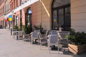 Fototapeta na wymiar WARSAW, POLAND - MARCH 22, 2022: Beautiful view of modern cafe with outdoor terrace