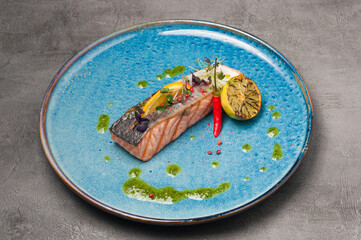 grilled salmon with skin with green oil and lemon