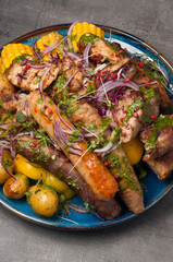 assorted meat, sausages and grilled vegetables in the restaurant