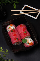 sushi rolls with tuna, omelette, shrimp and cream cheese